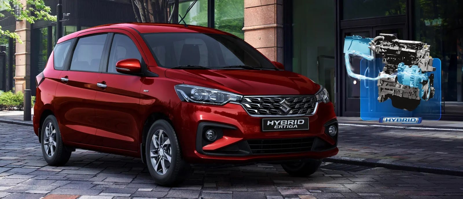 Dòng xe Suzuki Ertiga Hybrid màu bạc đang di chuyển trên đường, minh họa một lựa chọn xe hybrid 7 chỗ