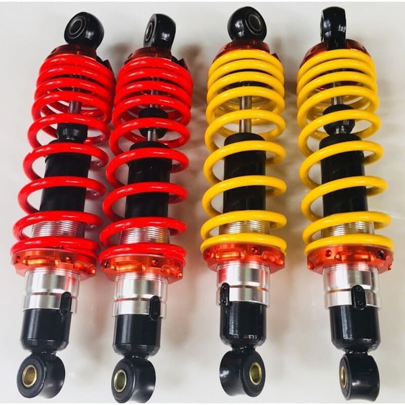 Hình ảnh cận cảnh một cặp phuộc giảm xóc của xe máy, thể hiện rõ cấu tạo và chi tiết bộ phận cần thay phuộc xe máy.