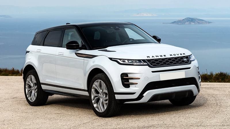 Land Rover Range Rover màu trắng sang trọng, đậu trên con đường đất, thể hiện khả năng vượt địa hình và đẳng cấp