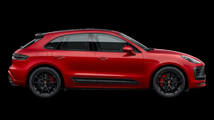 Một chiếc Macan màu xanh lam năng động chạy trên đường phố
