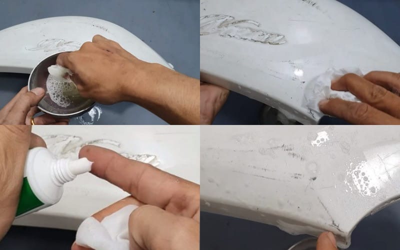Người đàn ông đang cẩn thận dùng kem đánh răng để xử lý vết xước xe máy trên bề mặt sơn bóng