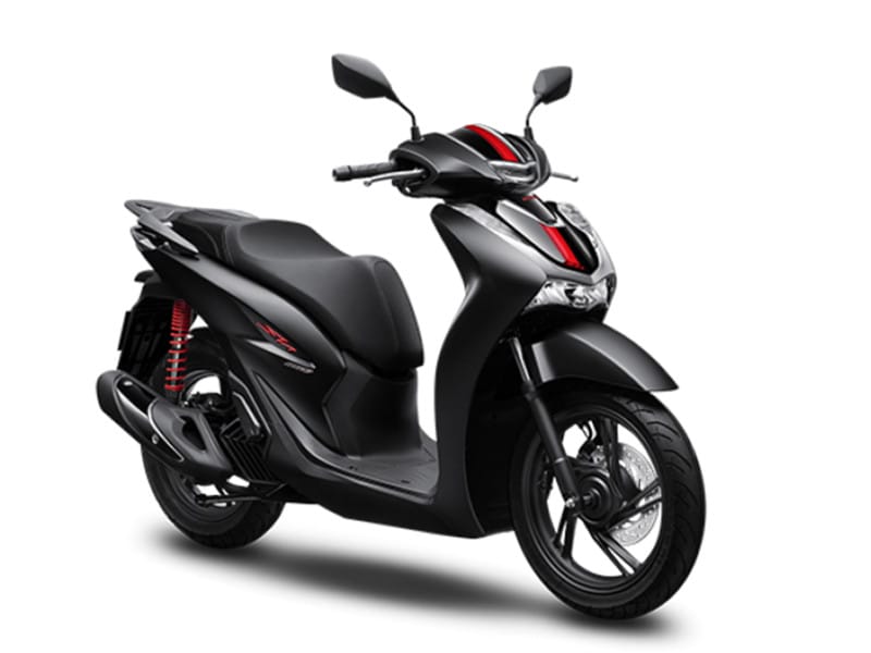 Xe Honda SH 160i 2023 màu trắng đang dừng bên đường, thể hiện vẻ sang trọng và hiện đại